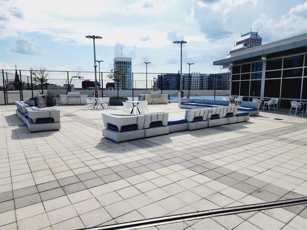 150 East Robinson Street, Unit 4A13 Orlando, FL 32801 - Photo 25 of 30 a view of roof deck with couches and potted plants