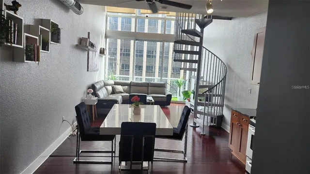 a view of a dining room with furniture window and wooden floor