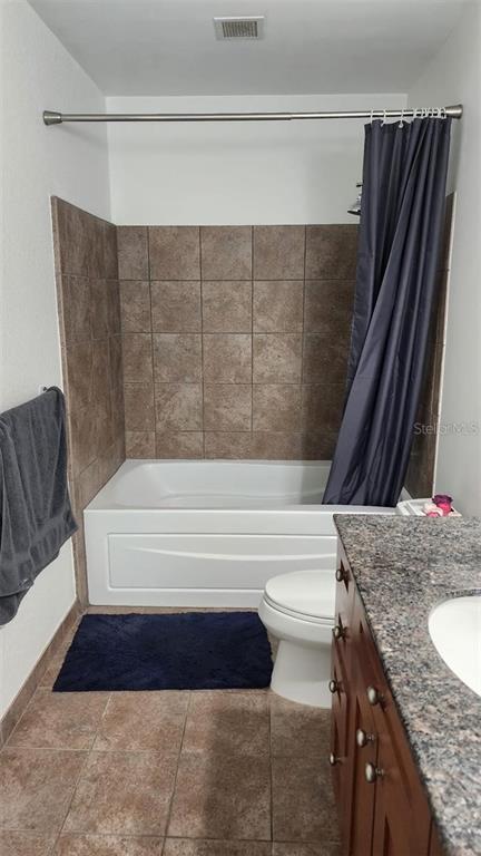 150 East Robinson Street, Unit 4A13 Orlando, FL 32801 - Photo 10 of 30 a bathroom with a granite countertop bathtub and shower