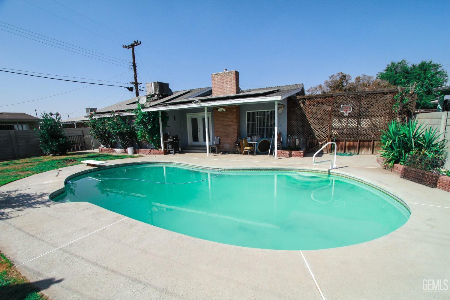 Undisclosed Address Bakersfield, CA 93309 - Photo 19 of 19 a view of a house with a swimming pool