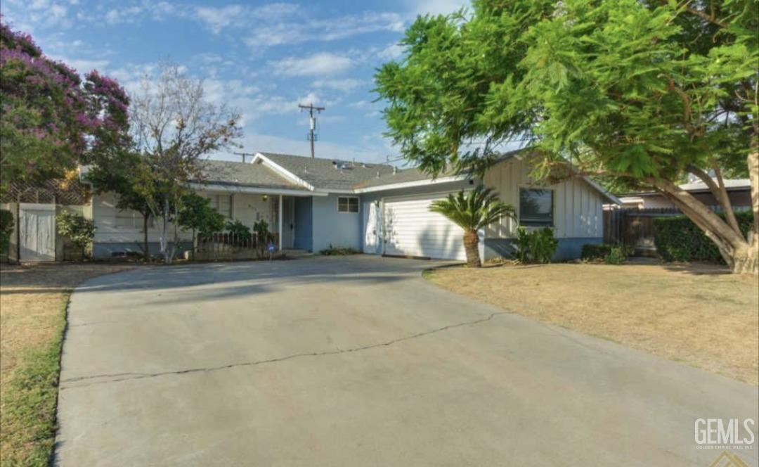 Undisclosed Address Bakersfield, CA 93309 - Photo 2 of 19 a view of a street with houses
