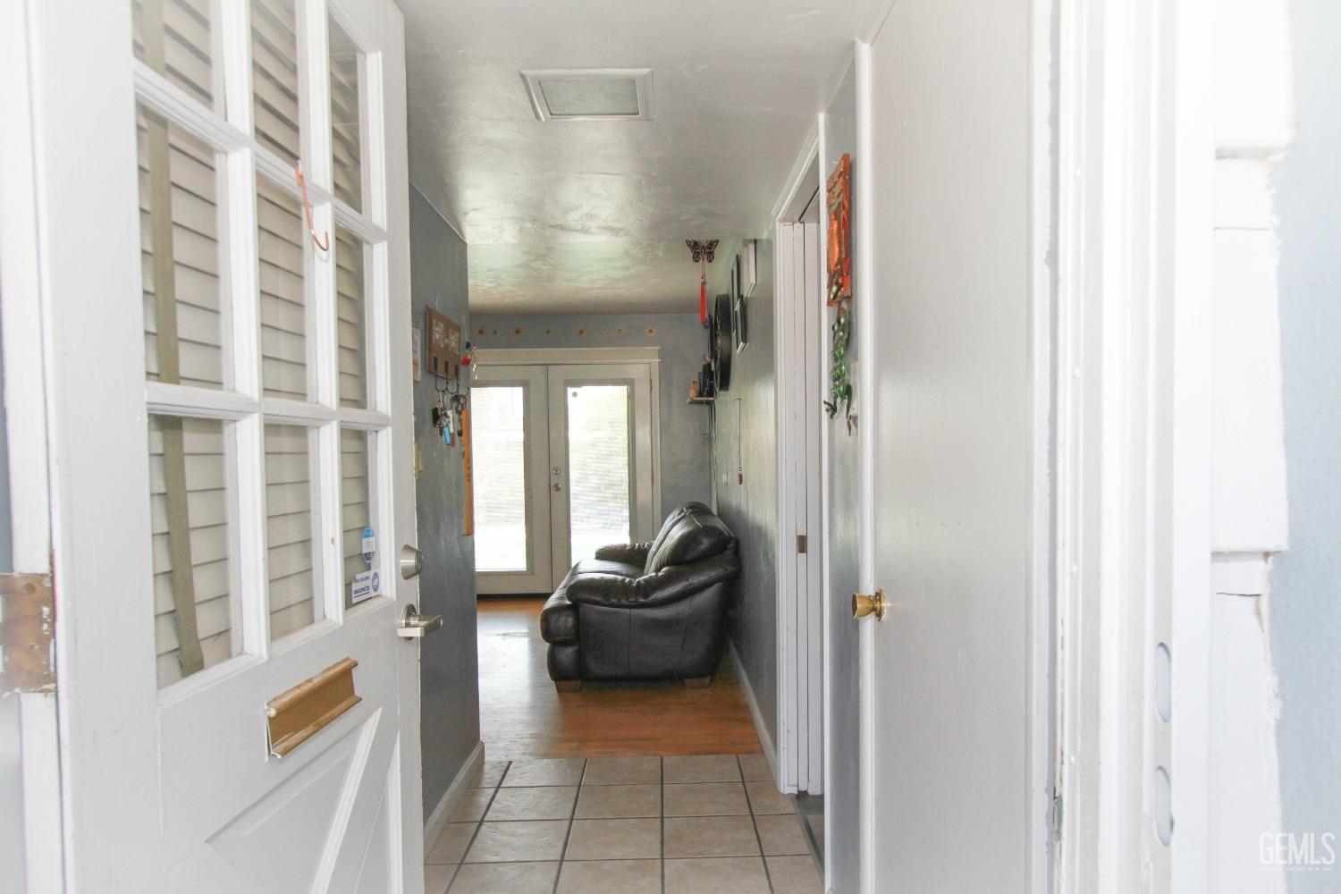 Undisclosed Address Bakersfield, CA 93309 - Photo 4 of 19 a hall way with furniture and a window