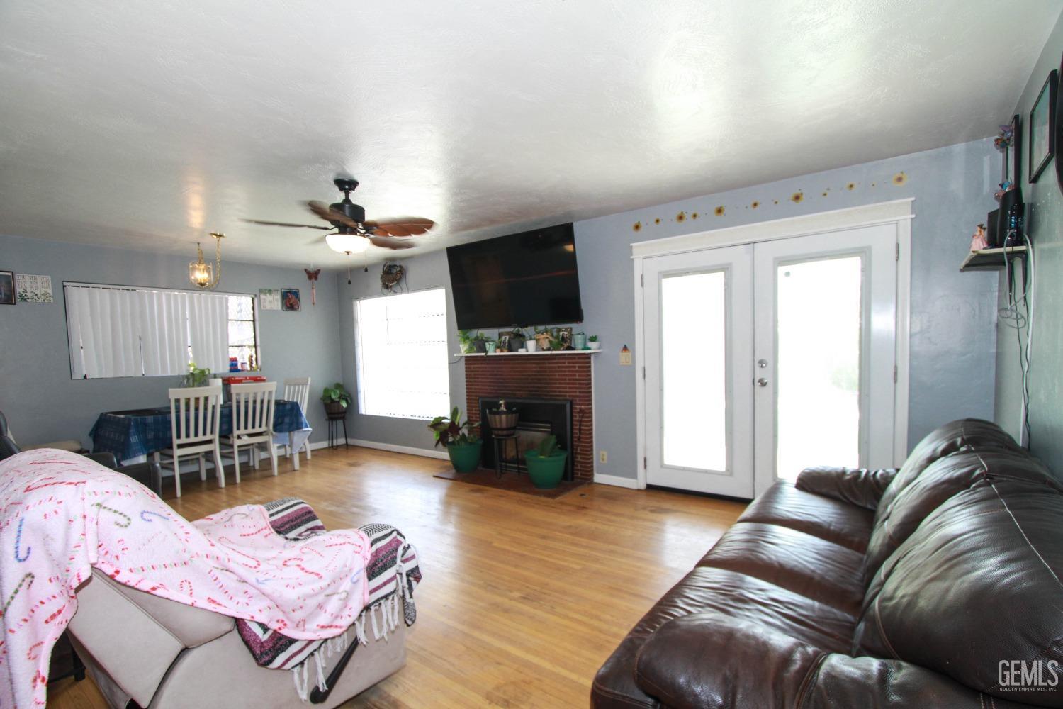 Undisclosed Address Bakersfield, CA 93309 - Photo 5 of 19 a living room with furniture and a fireplace
