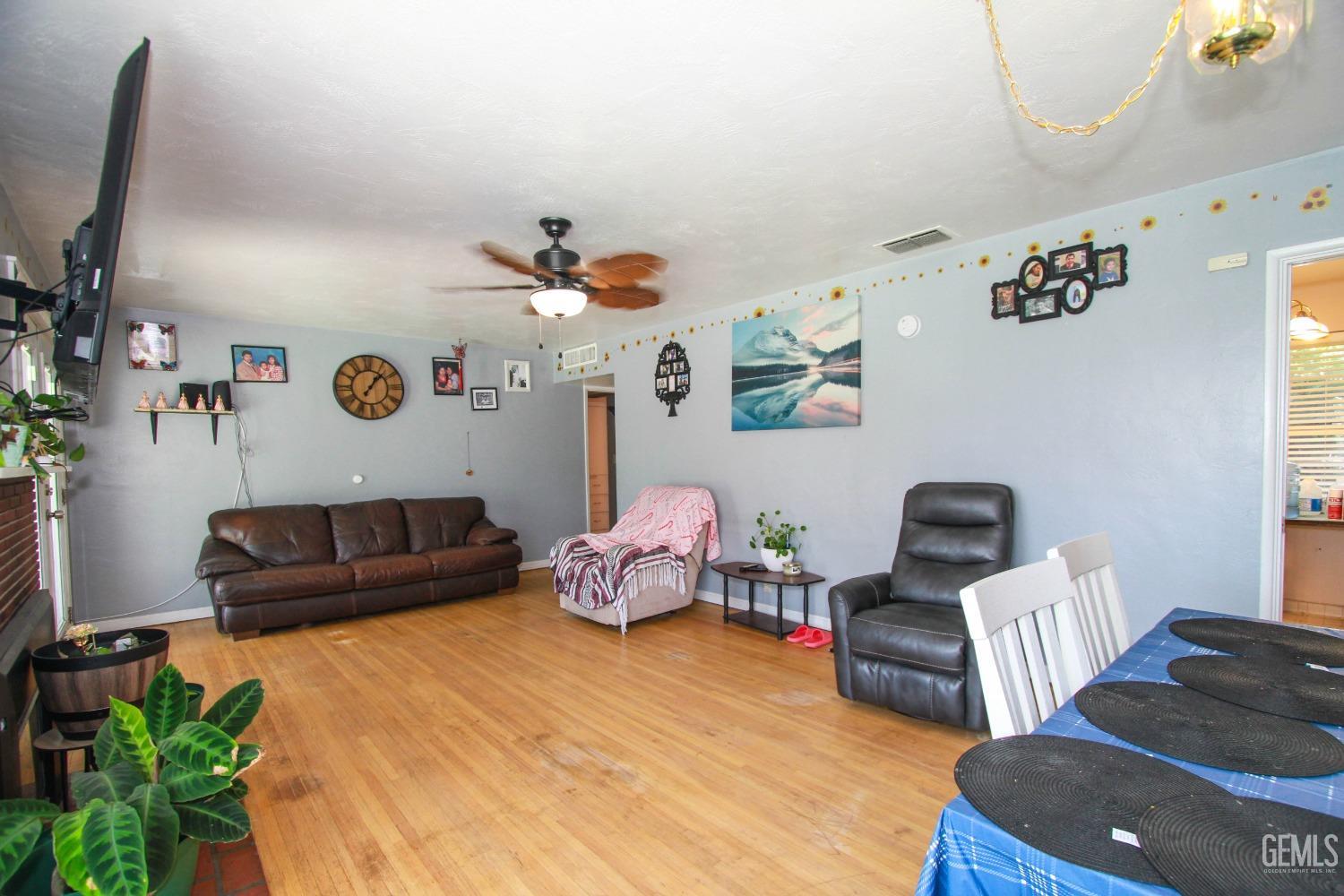 Undisclosed Address Bakersfield, CA 93309 - Photo 7 of 19 a living room with patio furniture and a window