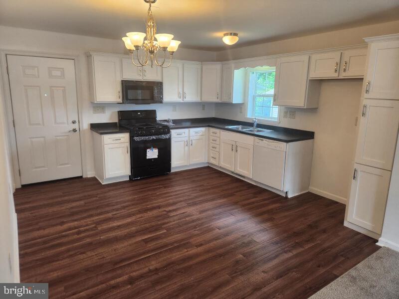 432 Ford Hook Road Doylestown, PA 18901 - Photo 3 of 9 a kitchen with granite countertop wooden floors stainless steel appliances and sink