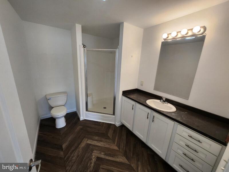 432 Ford Hook Road Doylestown, PA 18901 - Photo 8 of 9 a spacious bathroom with a toilet sink and mirror