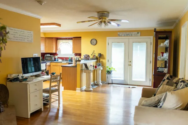 a view of a livingroom with furniture and a flat screen tv