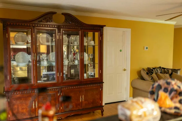 a front view of a house with a large window