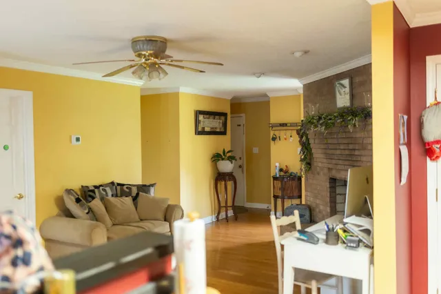 a living room with furniture and a walk in closet