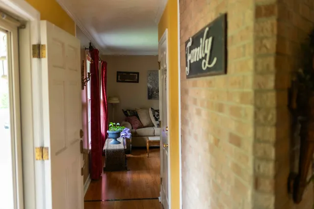a view of a hallway with a dining area