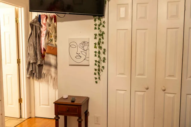 a view of a entryway with shower and a door