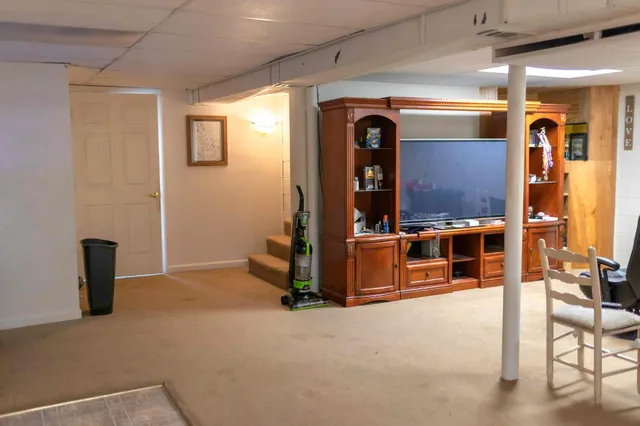 a view of livingroom with glass door and furniture