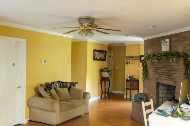 a living room with furniture and a fireplace