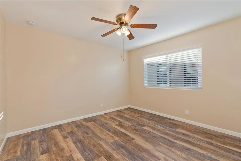 7675 Salix Place San Diego, CA 92129 - Photo 17 of 25 a view of room with window and ceiling fan