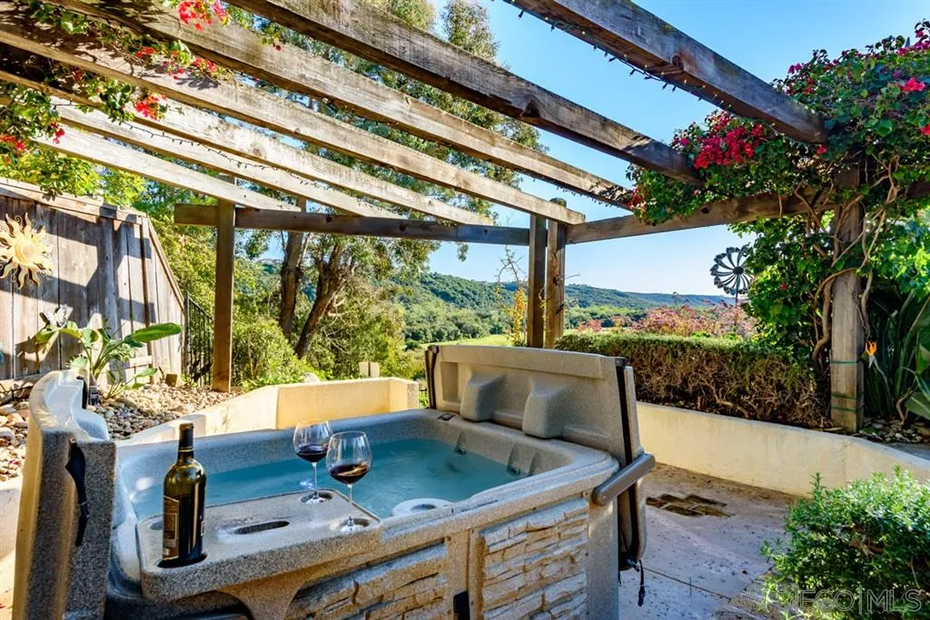7675 Salix Place San Diego, CA 92129 - Photo 22 of 25 a view of balcony with furniture and garden