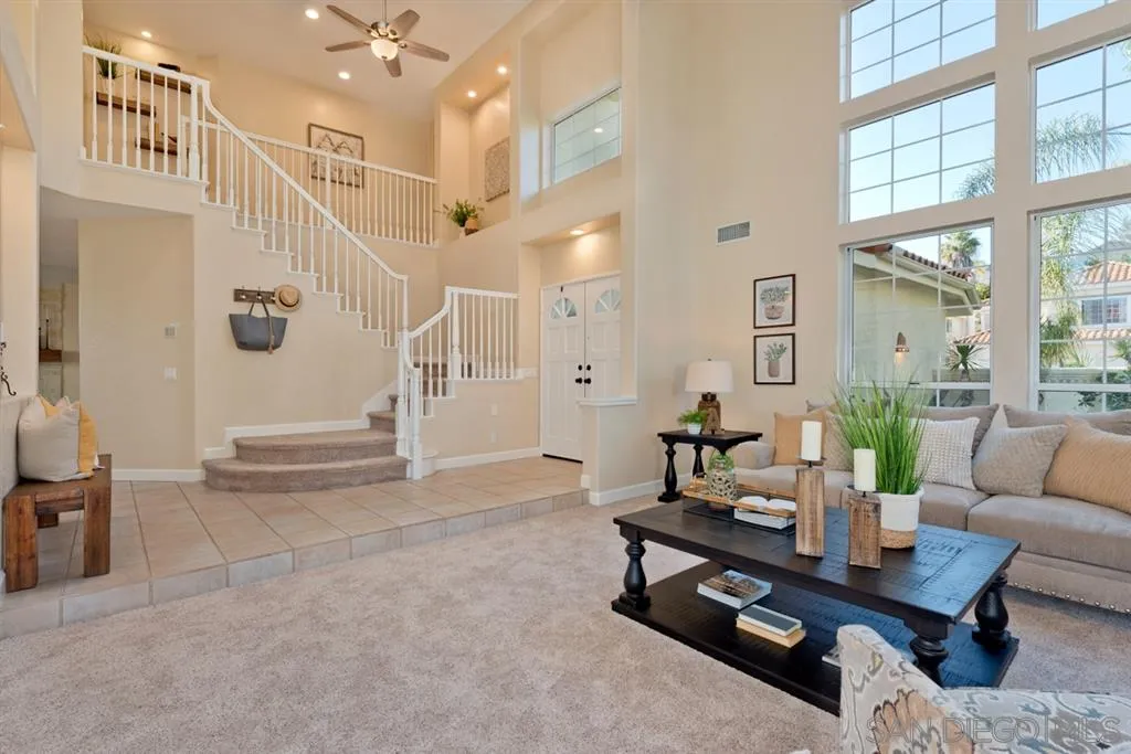 7675 Salix Place San Diego, CA 92129 - Photo 4 of 25 a living room with furniture a table and a potted plant