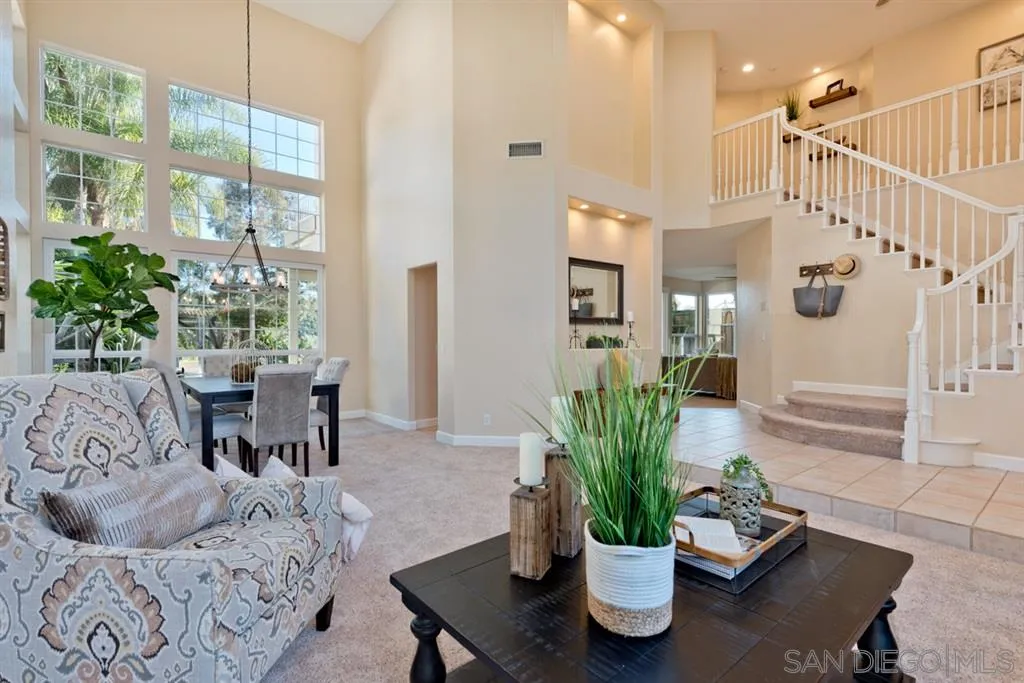 7675 Salix Place San Diego, CA 92129 - Photo 5 of 25 a living room with furniture potted plant and a large window