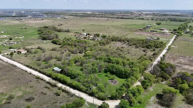 a view of a lake with a mountain and a forest