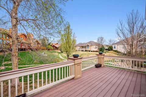a view of balcony with deck and wooden floor