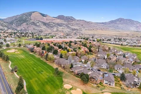 a view of a city with mountains in the background