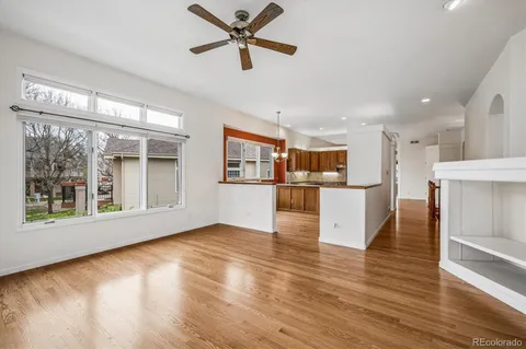 a view of kitchen with furniture and wooden floor