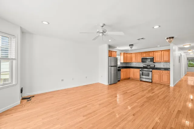 a view of kitchen with wooden floor