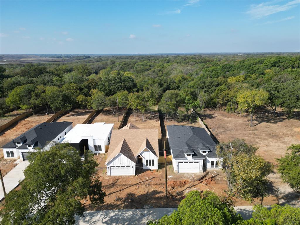 1115 Riverwood Road Dallas, TX 75217 - Photo 32 of 39 View of subject property with a forest