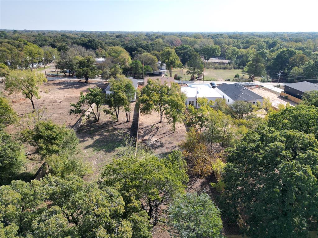 1115 Riverwood Road Dallas, TX 75217 - Photo 33 of 39 Drone / aerial view of a heavily wooded area