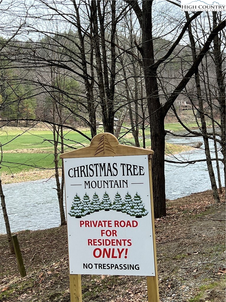 No # Edna Perry Road Crumpler, NC 28617 - Photo 2 of 6 a sign on the side of a building