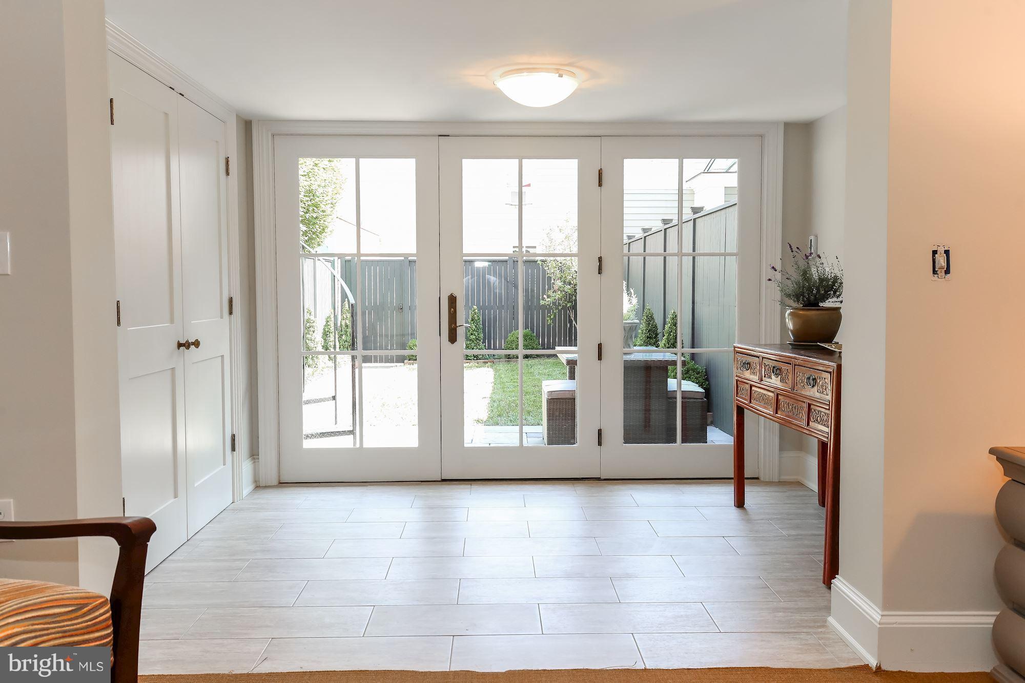 2802 P Street Northwest Washington, DC 20007 - Photo 13 of 17 a view of an entryway with wooden floor and windows