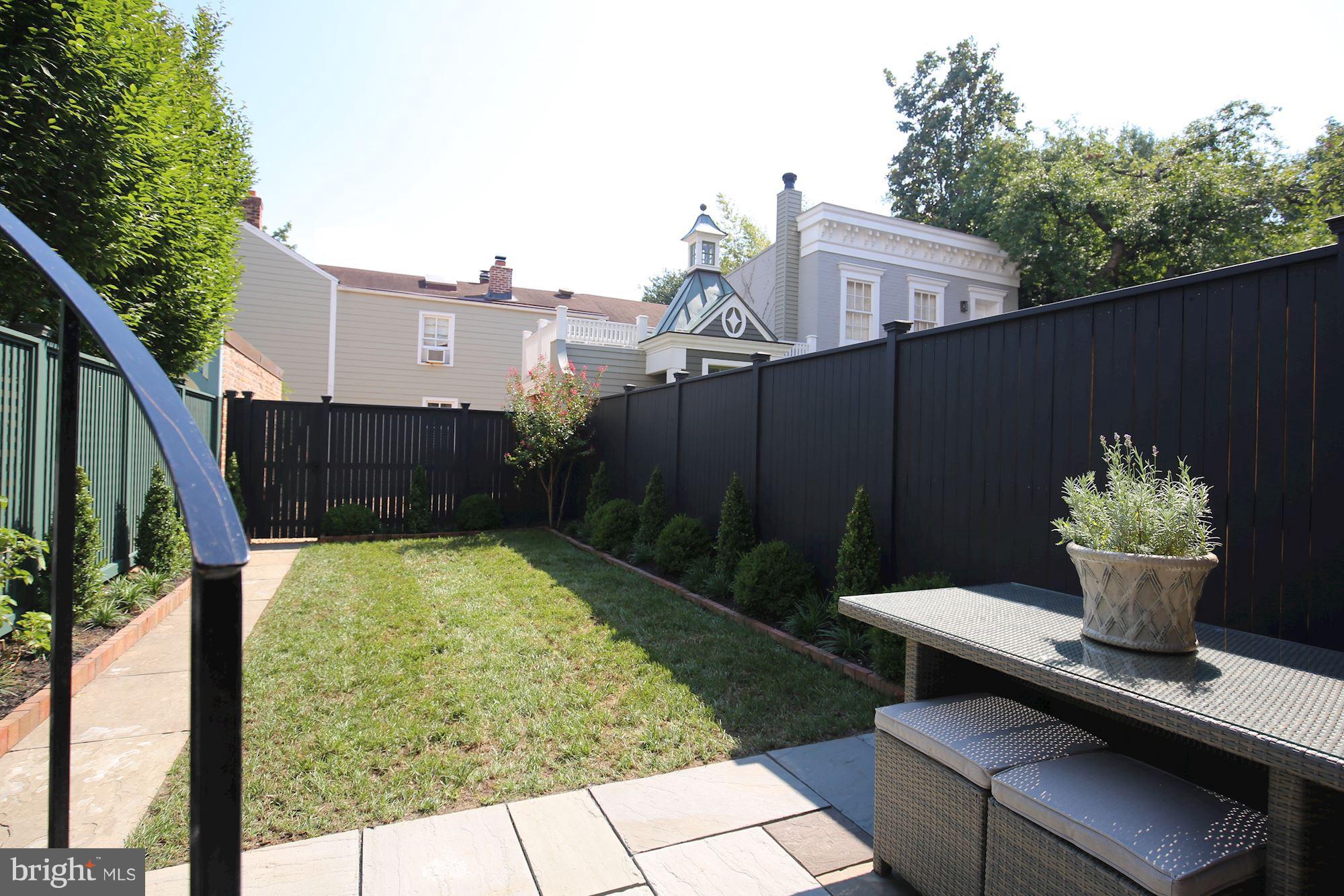 2802 P Street Northwest Washington, DC 20007 - Photo 15 of 17 a view of backyard with outdoor seating and plants