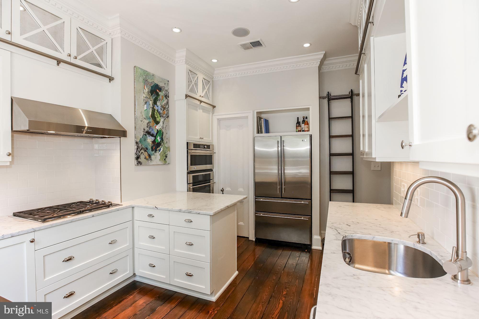 2802 P Street Northwest Washington, DC 20007 - Photo 4 of 17 a kitchen with granite countertop a refrigerator and a sink
