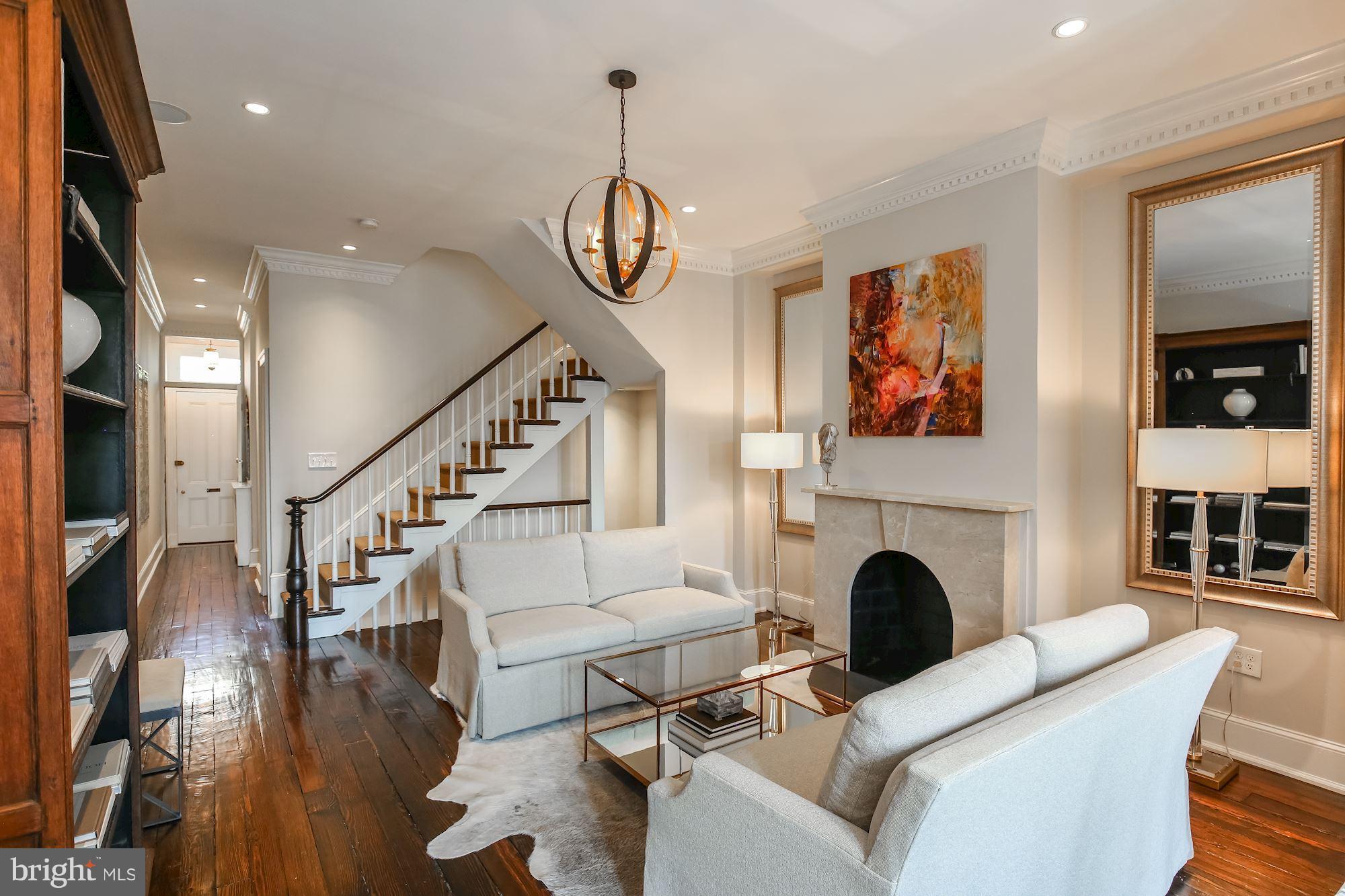 2802 P Street Northwest Washington, DC 20007 - Photo 5 of 17 a living room with furniture a fireplace and a floor to ceiling window