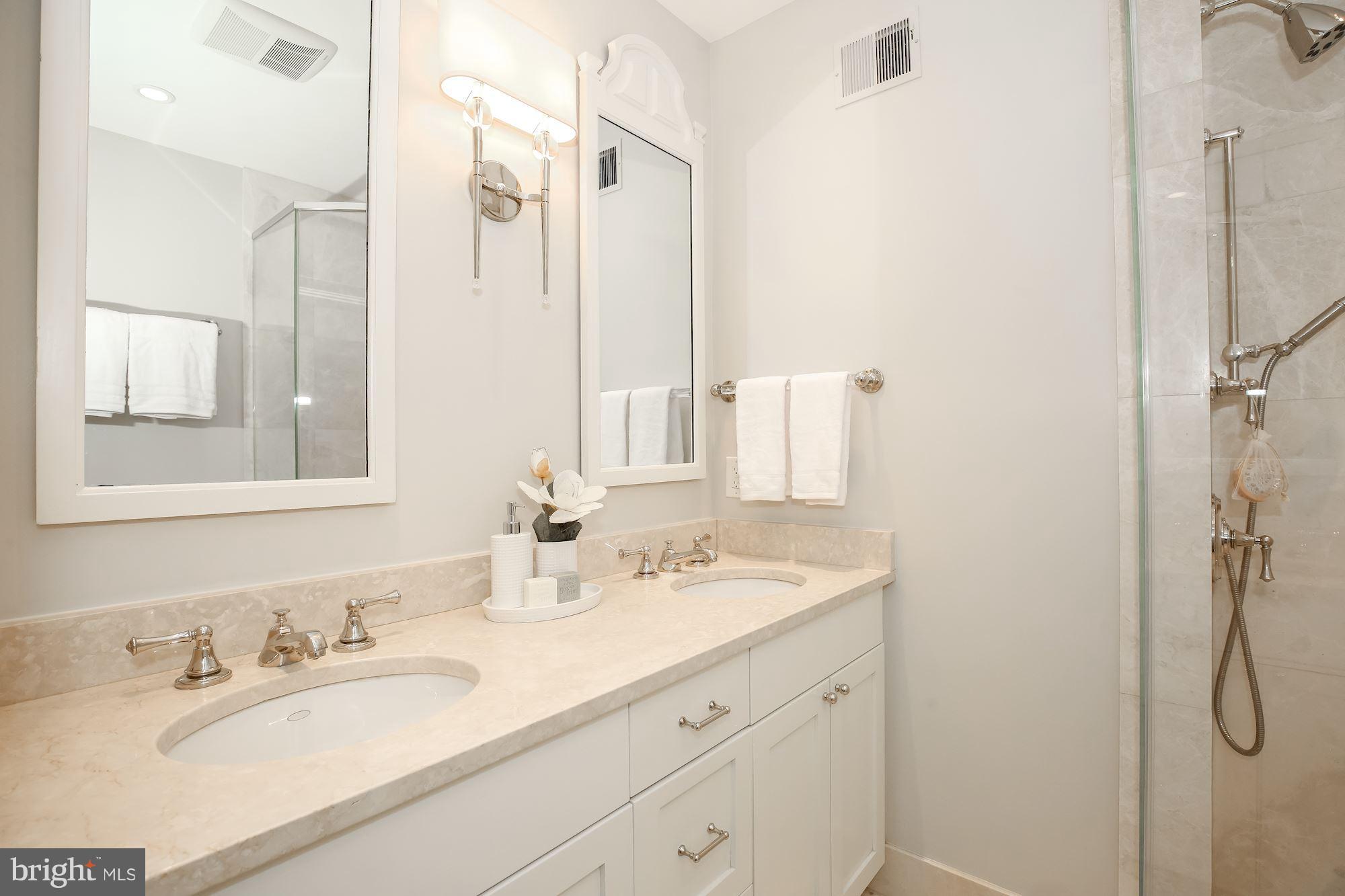 2802 P Street Northwest Washington, DC 20007 - Photo 8 of 17 a bathroom with a double vanity sink mirror and double