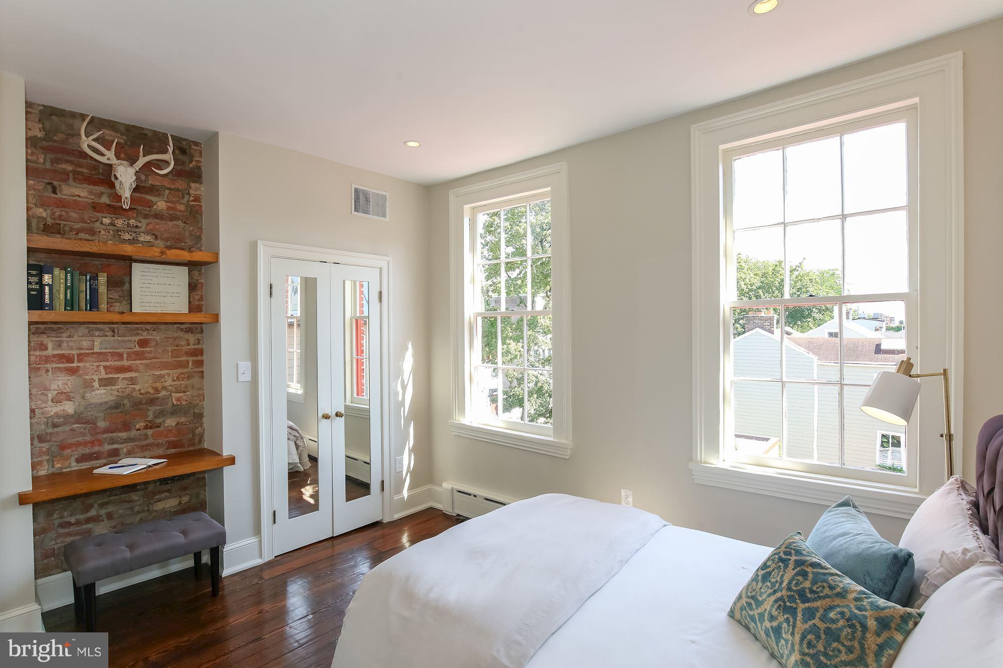 2802 P Street Northwest Washington, DC 20007 - Photo 9 of 17 a bedroom with a bed and wooden floor