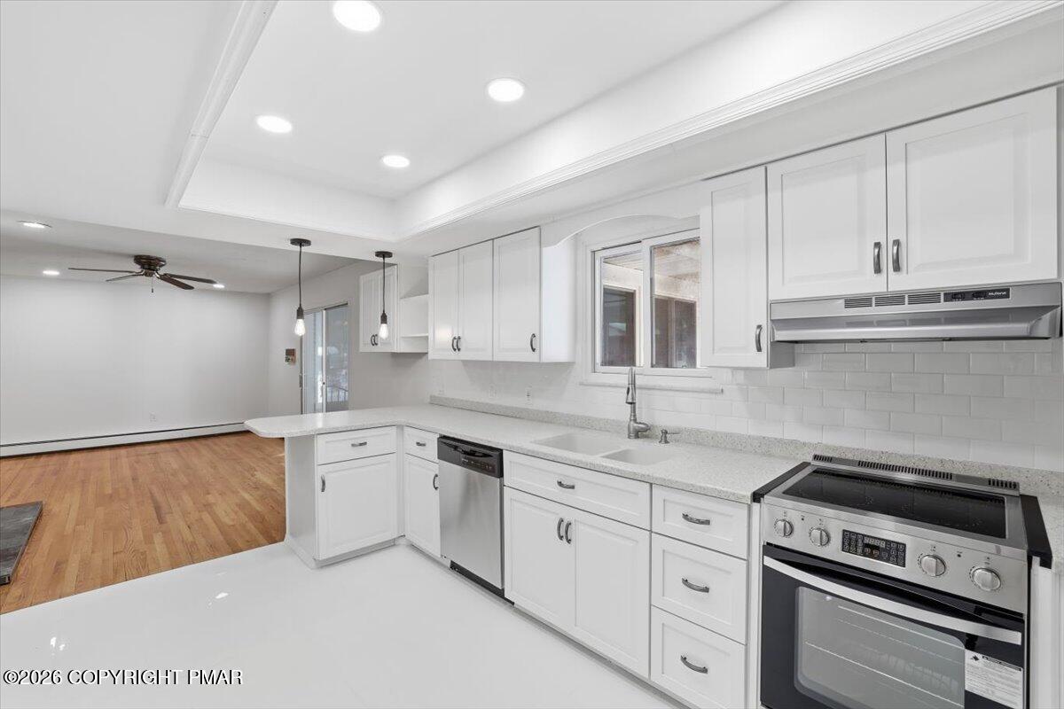 423 T R 620 Cresco, PA 18326 - Photo 12 of 37 a kitchen with granite countertop white cabinets and white appliances
