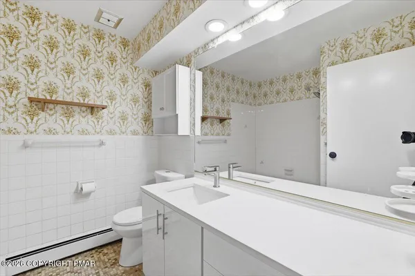 a bathroom with a bathtub and shower