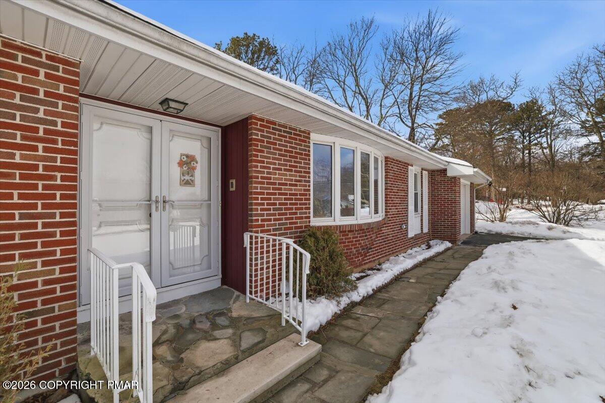 423 T R 620 Cresco, PA 18326 - Photo 2 of 37 a front view of a house with a tree