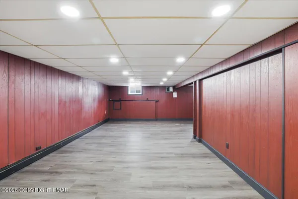 a view of a room with wooden floor