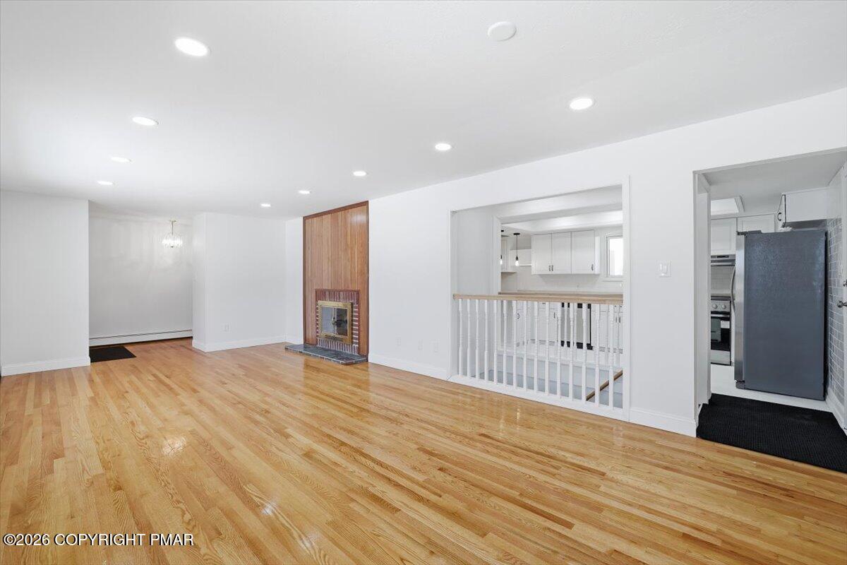 423 T R 620 Cresco, PA 18326 - Photo 6 of 37 a view of an empty room with wooden floor and a window