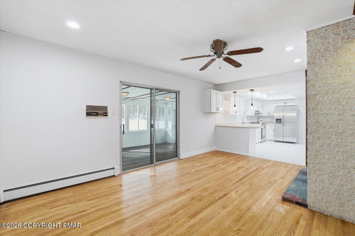 423 T R 620 Cresco, PA 18326 - Photo 8 of 37 a view of empty room with wooden floor and ceiling fan