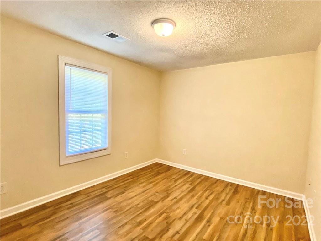 3367 Deerbrook Road Lenoir, NC 28645 - Photo 11 of 13 a view of empty room with wooden floor