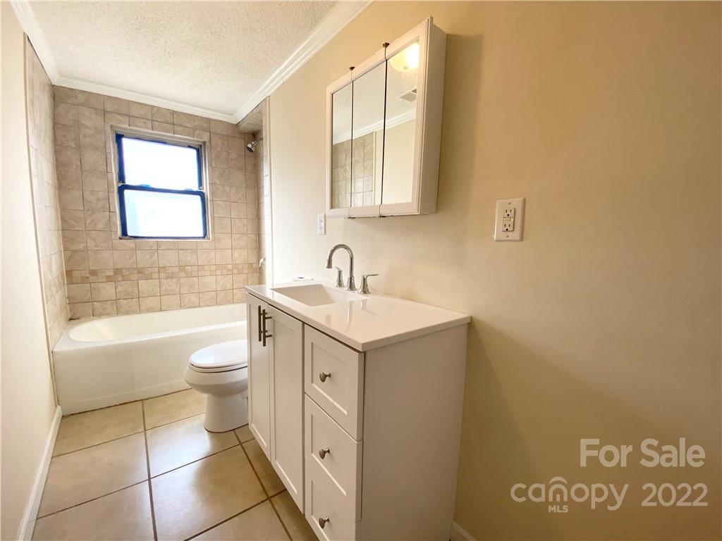 3367 Deerbrook Road Lenoir, NC 28645 - Photo 13 of 13 a bathroom with a sink toilet and shower