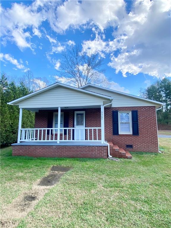 3367 Deerbrook Road Lenoir, NC 28645 - Photo 3 of 13 a front view of a house with garden