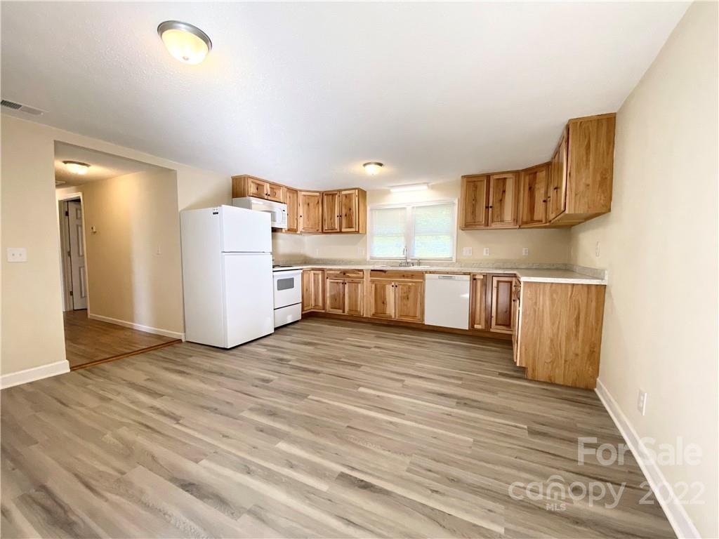 3367 Deerbrook Road Lenoir, NC 28645 - Photo 5 of 13 a view of kitchen and wooden floor