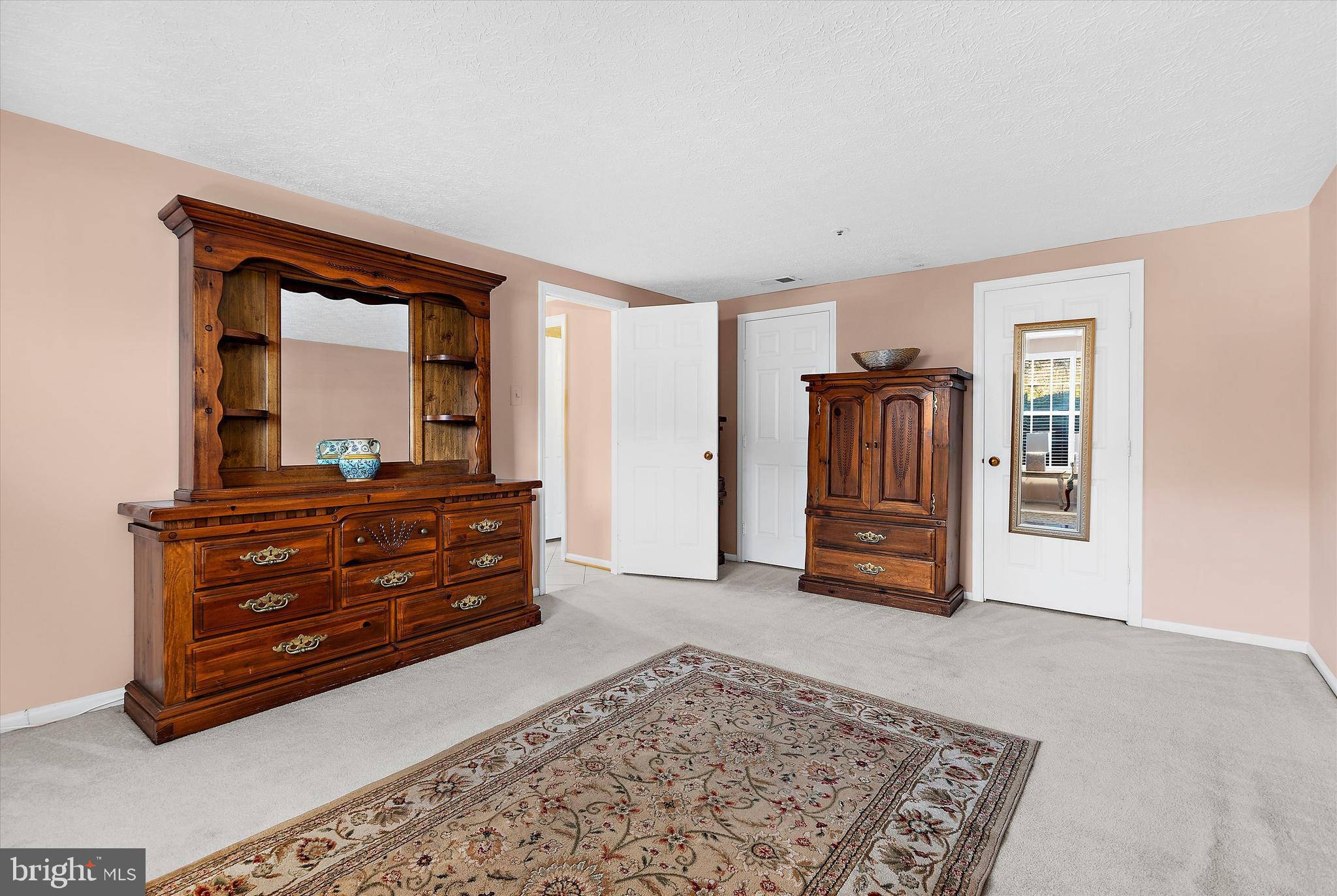 679 Deering Road, Unit 4D Pasadena, MD 21122 - Photo 22 of 28 a room with a bed and a dresser