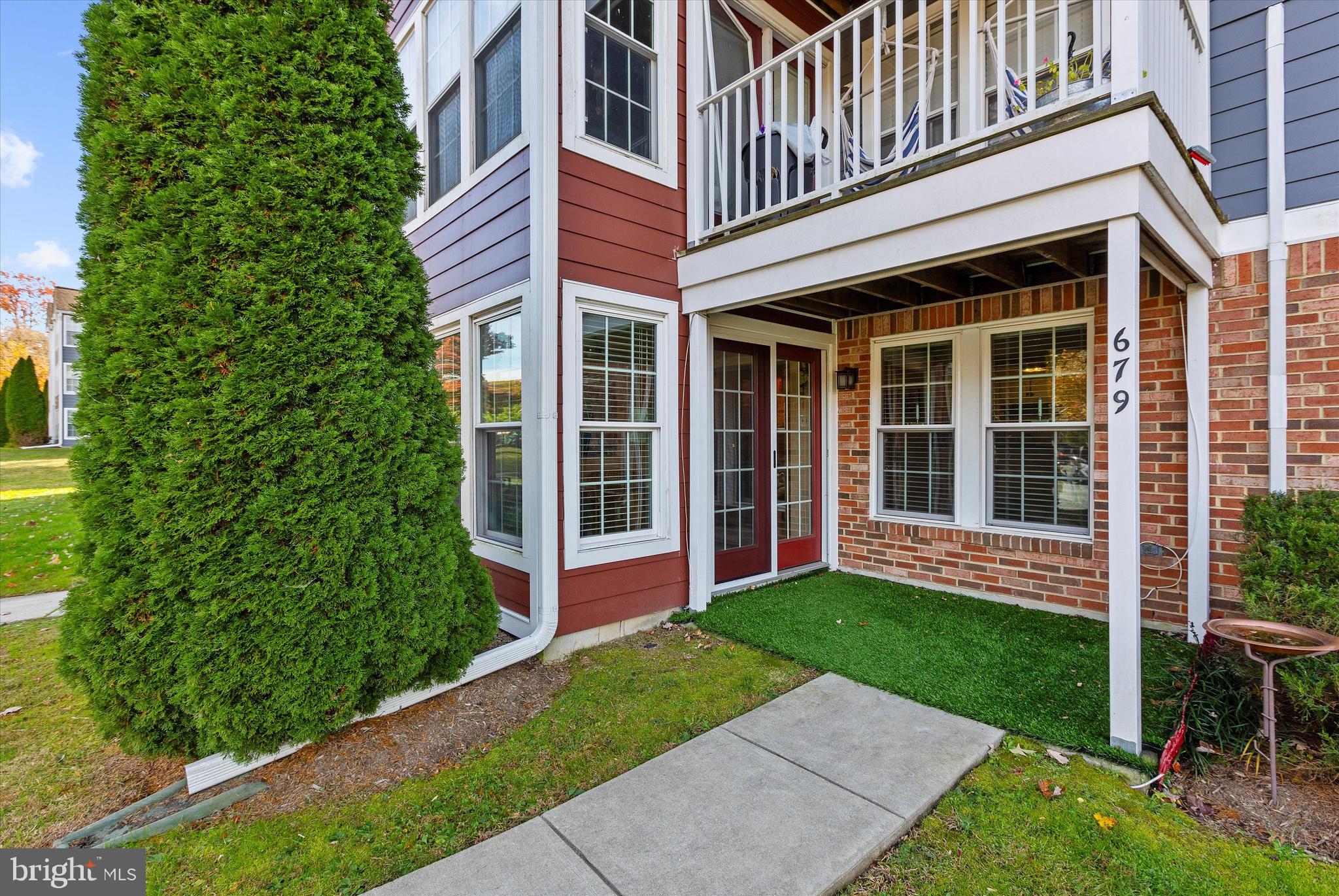679 Deering Road, Unit 4D Pasadena, MD 21122 - Photo 25 of 28 front view of a house with a yard