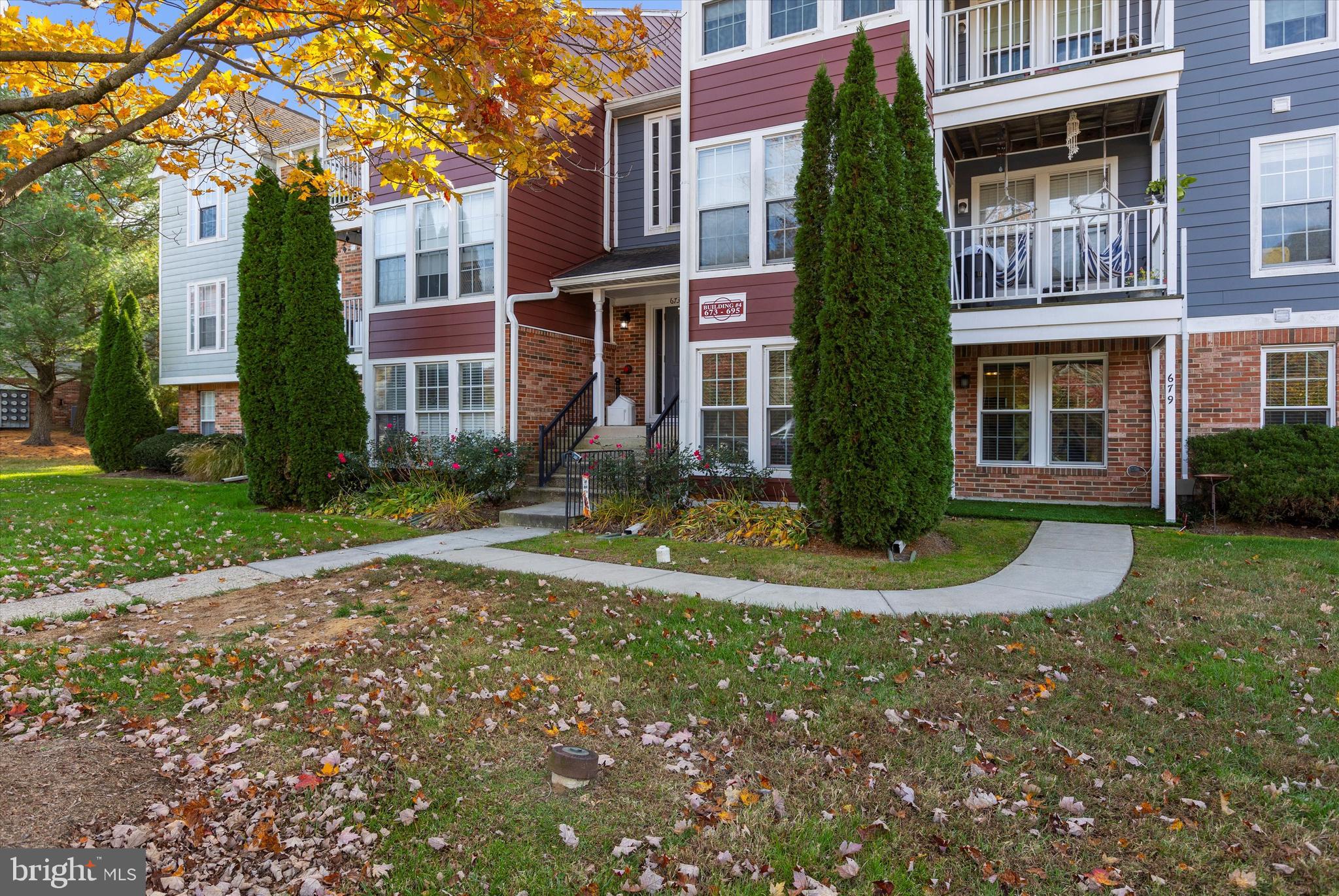 679 Deering Road, Unit 4D Pasadena, MD 21122 - Photo 28 of 28 a view of a house with a yard
