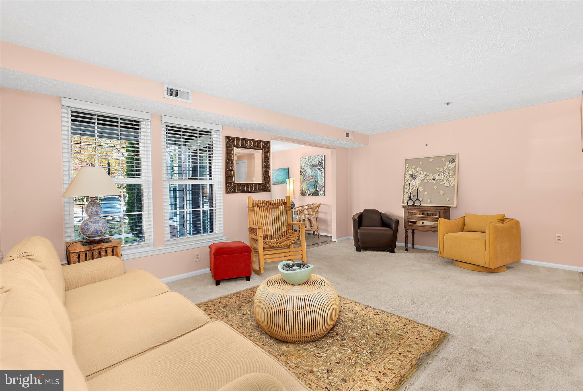 679 Deering Road, Unit 4D Pasadena, MD 21122 - Photo 4 of 28 a living room with furniture window and wooden floor
