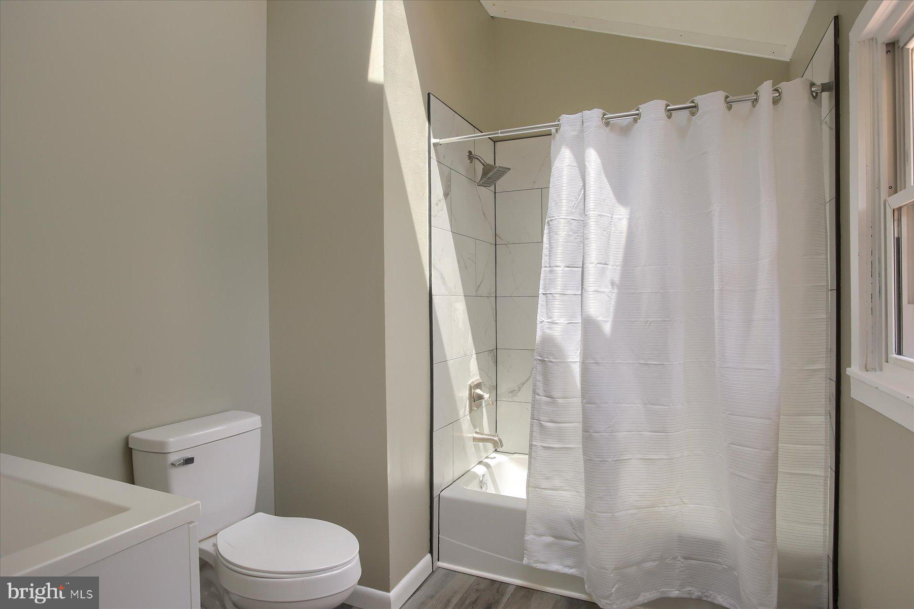 1441 Erney Road Dover, PA 17315 - Photo 17 of 45 a bathroom with a shower toilet and sink